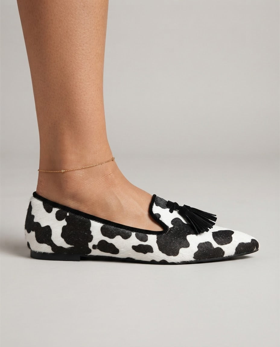 Ginevra Moccasin — Black and White Cow Print, Black Tassels