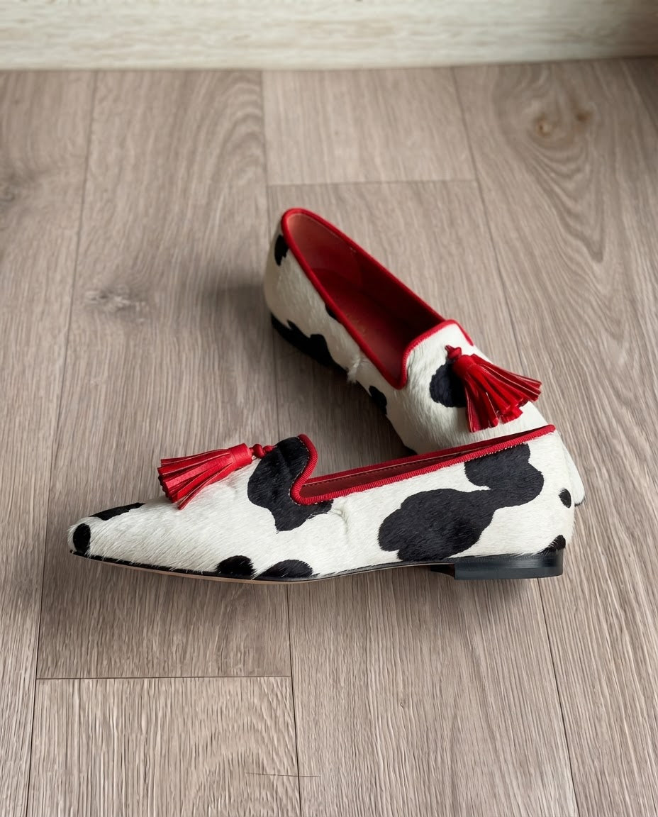 Ginevra Moccasin — Black and White Cow Print, Red Tassels